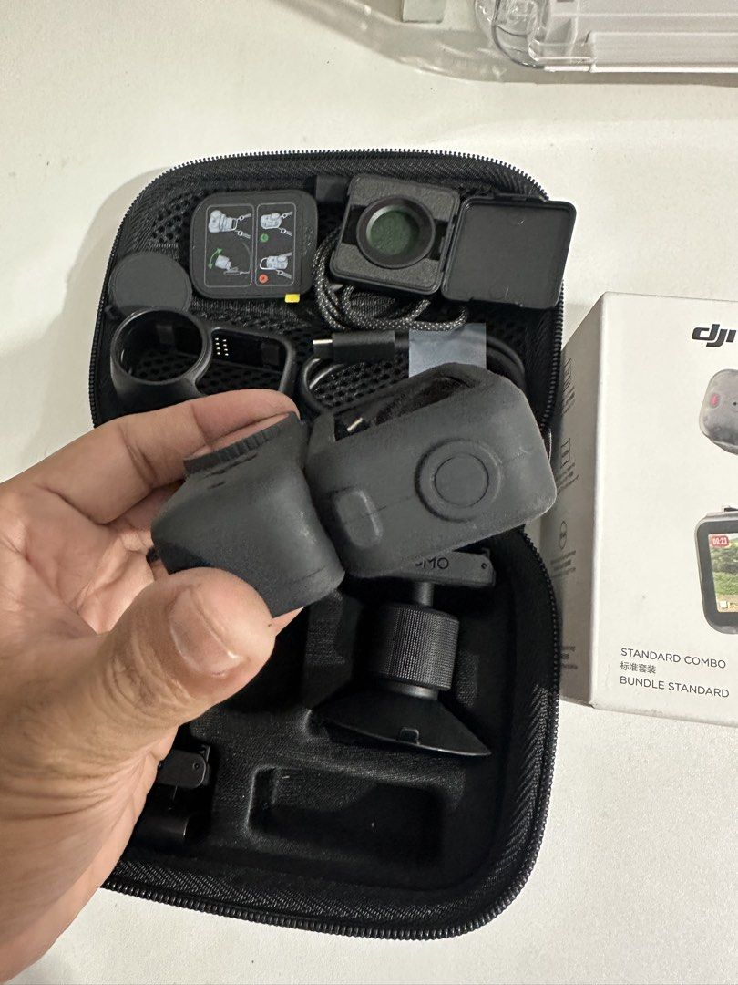 DJI Osmo Nano Standard Combo 128GB (Category: Video Cameras) located in Taytay. Submitted by jc.cruz03 (Listing ID 1470570645, Image 3). Description: - Item: DJI Osmo Nano Standard Combo - Storage: 128GB - Inclusions: Carrying case, protective cases, charging cable, lens filters, and mounting accessories - Packaging: Original retail box included - Portability: All items pack neatly into a fitted zipper case for easy travel - Condition: Complete s