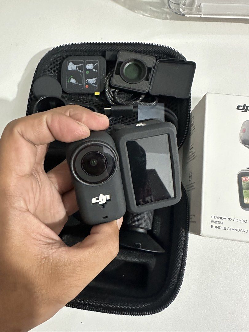 DJI Osmo Nano Standard Combo 128GB (Category: Video Cameras) located in Taytay. Submitted by jc.cruz03 (Listing ID 1470570645, Image 2). Description: - Item: DJI Osmo Nano Standard Combo - Storage: 128GB - Inclusions: Carrying case, protective cases, charging cable, lens filters, and mounting accessories - Packaging: Original retail box included - Portability: All items pack neatly into a fitted zipper case for easy travel - Condition: Complete s