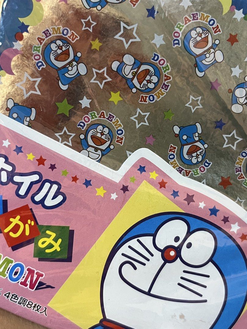 Doraemon foil chiyogami origami paper pack (Category: Craft Supplies & Tools) located in Gapan. Submitted by lunashop14 (Listing ID 1470627835, Image 3). Description: - Authentic Doraemon foil chiyogami origami paper, made in Japan by Shogwacraft - Brand new and unopened pack - Size: 145mm x 145mm - Includes 8 sheets total with 4 vibrant color tones - Features a beautiful shiny foil finish, perfect for various craft projects.
