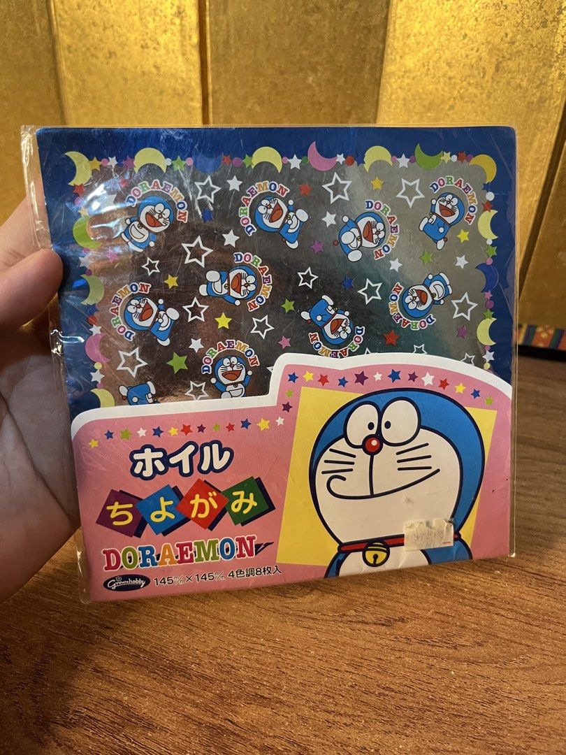 Doraemon foil chiyogami origami paper pack (Category: Craft Supplies & Tools) located in Gapan. Submitted by lunashop14 (Listing ID 1470627835, Image 1). Description: - Authentic Doraemon foil chiyogami origami paper, made in Japan by Shogwacraft - Brand new and unopened pack - Size: 145mm x 145mm - Includes 8 sheets total with 4 vibrant color tones - Features a beautiful shiny foil finish, perfect for various craft projects.