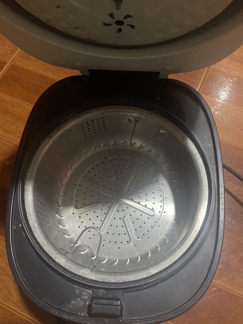 Dowell Intelligent Hypoglycemic Rice Cooker (Category: Cookers) located in Quezon City. Submitted by markgonzales_ (Listing ID 1470656246, Image 2). Description: - Brand/Model: Black Dowell Intelligent Hypoglycemic Rice Cooker - Features: Digital control panel on top, integrated steam vent, and standard attached power cord - Condition: Fully working condition, shows minor dust, smudges, and surface wear on the exterior body (needs a quick wipe do