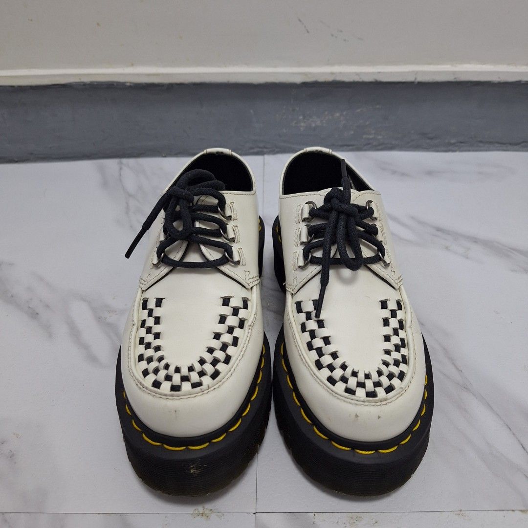 Dr. Martens Ashley Creepers White Black (Category: Loafers) located in Taguig. Submitted by moreken1985 (Listing ID 1470629854, Image 2). Description: - Brand: Dr. Martens - Model: Ashley Creepers - Color: White with black woven toe detail - Features: Chunky platform sole, iconic yellow contrast stitching, lace-up closure with black laces and metallic eyelets - Size: UK 3 / US M 4 / US L 5 / EU 36 - Origin: Made in China - Condition: Clean leathe