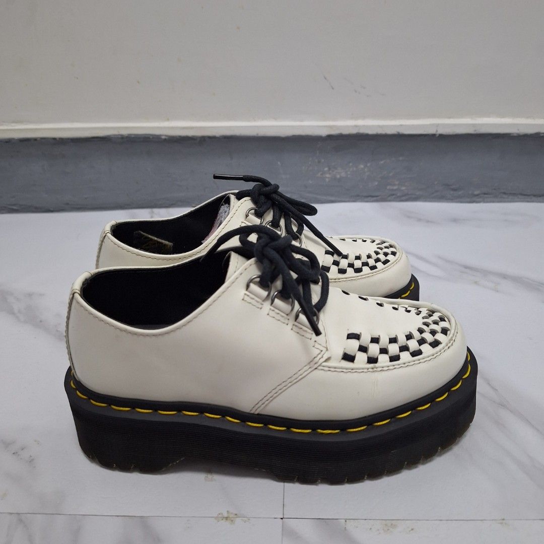 Dr. Martens Ashley Creepers White Black (Category: Loafers) located in Taguig. Submitted by moreken1985 (Listing ID 1470629854, Image 3). Description: - Brand: Dr. Martens - Model: Ashley Creepers - Color: White with black woven toe detail - Features: Chunky platform sole, iconic yellow contrast stitching, lace-up closure with black laces and metallic eyelets - Size: UK 3 / US M 4 / US L 5 / EU 36 - Origin: Made in China - Condition: Clean leathe