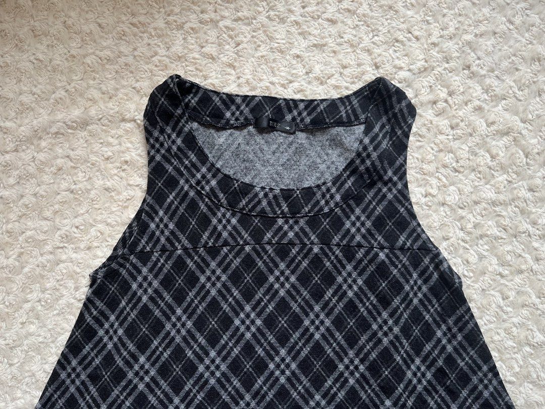 Dress Over Jeans Plaid Top (Category: Sleeveless) located in Mandaluyong City. Submitted by namislounge (Listing ID 1470674107, Image 3). Description: - Brand/Style: DIRZ sleeveless top - Pattern: Classic black and white plaid - Size: Medium (tag at neck) - Details: Scoop neckline, structured collar, slightly flared A-line silhouette - Fabric: Soft, lightweight, with stretch - Condition/Use: Great casual piece for layering or wearing solo.