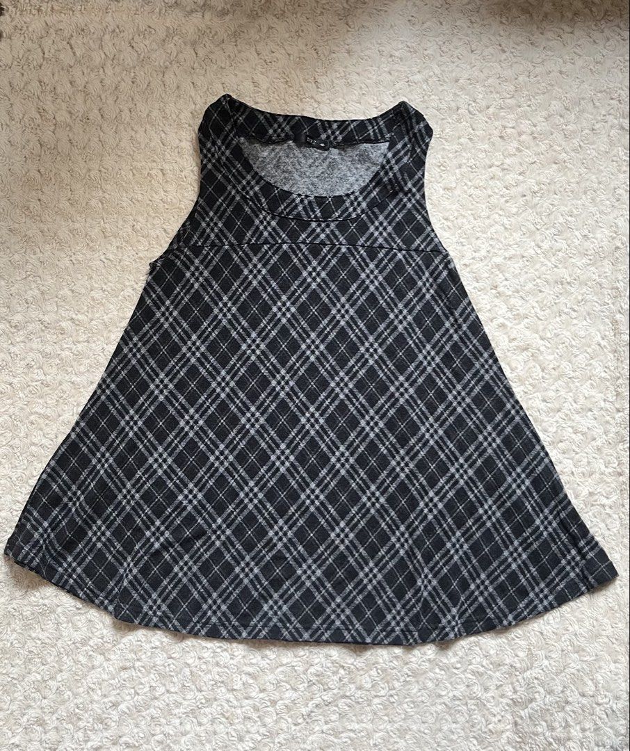 Dress Over Jeans Plaid Top (Category: Sleeveless) located in Mandaluyong City. Submitted by namislounge (Listing ID 1470674107, Image 1). Description: - Brand/Style: DIRZ sleeveless top - Pattern: Classic black and white plaid - Size: Medium (tag at neck) - Details: Scoop neckline, structured collar, slightly flared A-line silhouette - Fabric: Soft, lightweight, with stretch - Condition/Use: Great casual piece for layering or wearing solo.