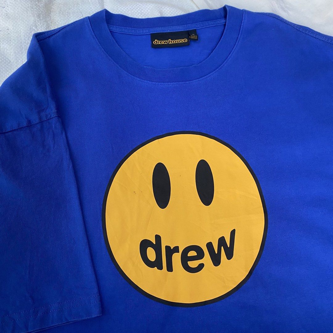 drew house Mascot SS Tee Royal Blue (Category: Tshirts & Polo Shirts ) located in Dagupan City. Submitted by marinonghustler (Listing ID 1470576149, Image 2). Description: - Brand: Drew House - Style: Short sleeve crew neck t-shirt - Color: Royal Blue with large yellow smiley face 'drew' front graphic - Size: Large - Width 23.5 x Length 29 - Condition: Good asnew -Pangasinan .