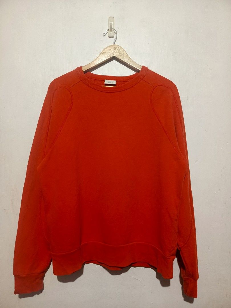 DRIES VAN NOTEN ORANGE SWEATSHIRT (Category: Luxury Apparel) located in Baguio. Submitted by 074thriftmania (Listing ID 1470647831, Image 1). Description: - Brand: Dries Van Noten - Color: Bright orange - Style: Classic crewneck pullover with raglan sleeves - Details: Ribbed cuffs and hem - Material: Comfortable heavyweight fabric - Size: Small - Condition: Excellent luxury streetwear staple length 24" width 23.5".