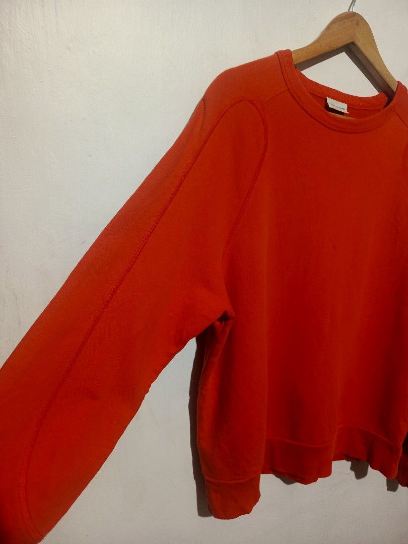 DRIES VAN NOTEN ORANGE SWEATSHIRT (Category: Luxury Apparel) located in Baguio. Submitted by 074thriftmania (Listing ID 1470647831, Image 2). Description: - Brand: Dries Van Noten - Color: Bright orange - Style: Classic crewneck pullover with raglan sleeves - Details: Ribbed cuffs and hem - Material: Comfortable heavyweight fabric - Size: Small - Condition: Excellent luxury streetwear staple length 24" width 23.5".