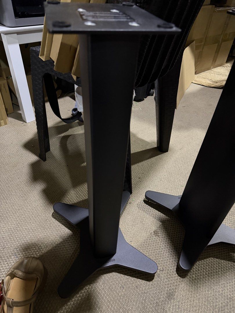 Dynaudio Stand 10 Speaker Stands Black Pair (Category: Soundbars, Speakers & Amplifiers) located in Quezon City. Submitted by tkgarcia-46415 (Listing ID 1470741988, Image 3). Description: - Brand/Model: Dynaudio Stand 10 - Color: Sleek black finish - Build: Heavy-duty metal construction with a stable four-legged base - Features: Hollow central column for neat cable management - Compatibility: Equipped with top plate rubber pads for bookshelf spea