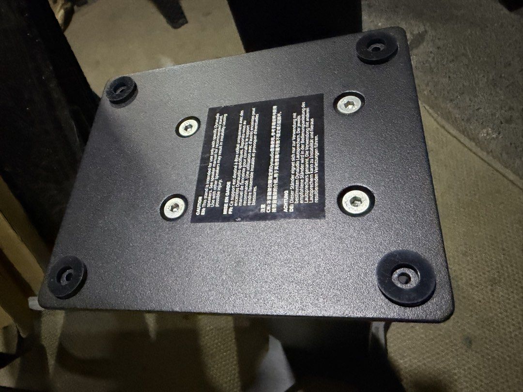 Dynaudio Stand 10 Speaker Stands Black Pair (Category: Soundbars, Speakers & Amplifiers) located in Quezon City. Submitted by tkgarcia-46415 (Listing ID 1470741988, Image 2). Description: - Brand/Model: Dynaudio Stand 10 - Color: Sleek black finish - Build: Heavy-duty metal construction with a stable four-legged base - Features: Hollow central column for neat cable management - Compatibility: Equipped with top plate rubber pads for bookshelf spea