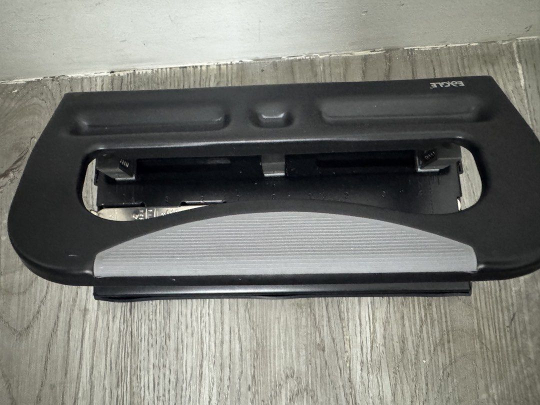 Eagle Heavy Duty Adjustable 3-Hole Punch (Category: Stationery & School Supplies) located in Manila. Submitted by decluterthings888 (Listing ID 1470559782, Image 3). Description: - Brand: Eagle - Color: Black, heavy-duty build - Condition: Clean and works smoothly with no jams - Features adjustable punch heads for custom spacing - Includes built-in paper guide ruler on the base - Designed with a sturdy metal body and comfortable rubber grip handl