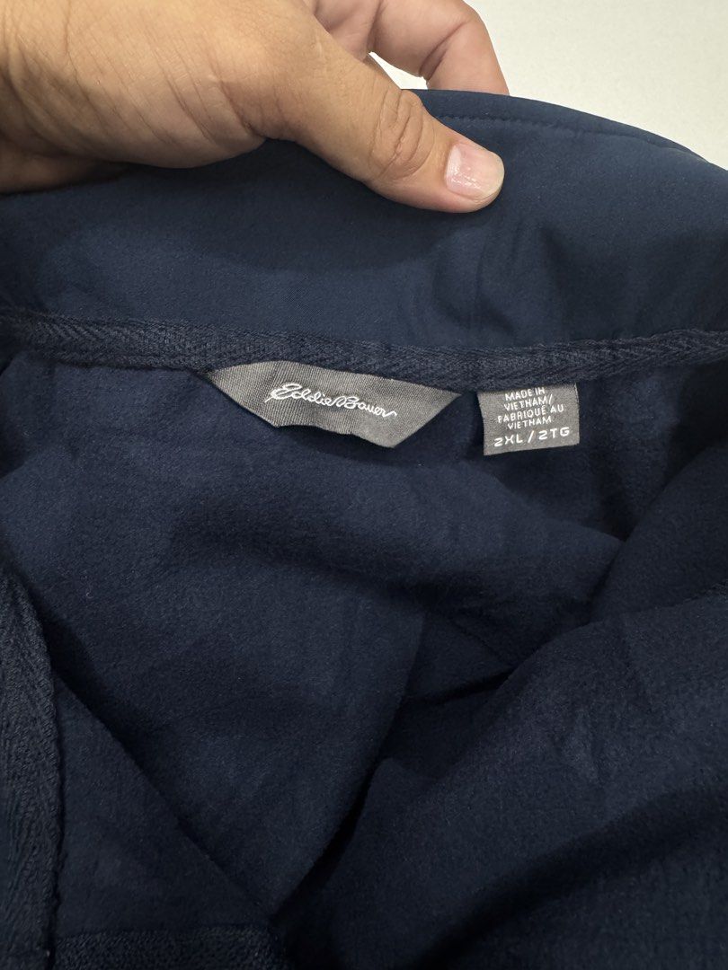 Eddie Bauer Blue Zip Jacket 2XL (Category: Coats, Jackets and Outerwear) located in Bustos. Submitted by thenlnclot60500 (Listing ID 1470634938, Image 2). Description: - Brand: Eddie Bauer - Size: 2XL - Color: Solid Navy Blue - Material: 100% polyester shell - Pockets: Two secure zippered side pockets - Care: Machine washable and easy care - Perfect as a classic outdoor layering piece for cooler weather - Condition: Excellent.