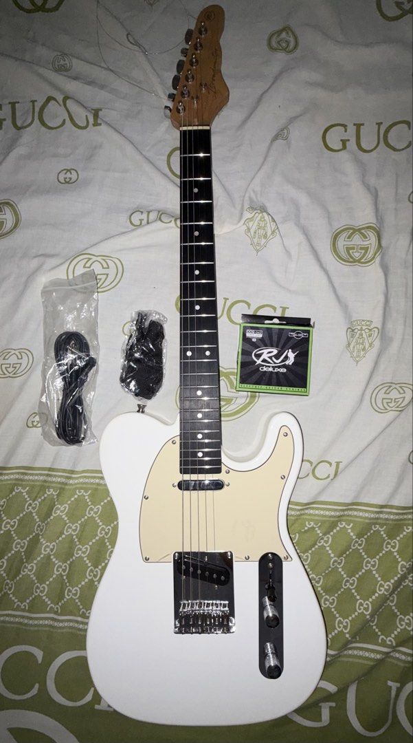 ELECTRIC GUITAR (Category: Musical Instruments) located in Manila. Submitted by akii.0815 (Listing ID 1470603087, Image 1). Description: RJ ELECTRIC GUITAR WITH BAG AND CABLES.
