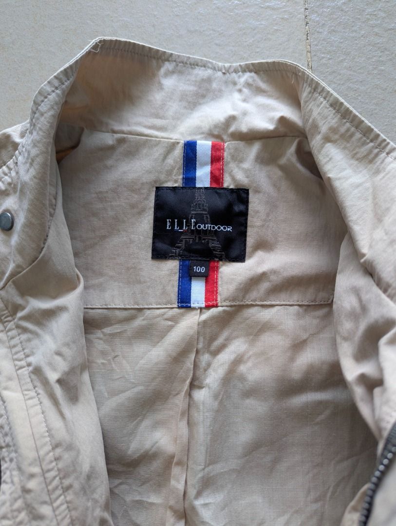 Elle Outdoor Striped Zip-Up Jacket Size 100 (Category: Coats, Jackets and Outerwear) located in General Santos City (Dadiangas). Submitted by mobius_stitch (Listing ID 1470674993, Image 3). Description: - Brand/Model: Elle Outdoor Jacket - Color: Beige and olive green with horizontal stripes - Size: 100 (Tag size) - Material: Mixed cotton and nylon blend - Details: Full zip closure, stand collar, front flap pockets, shoulder epaulets - Condition: