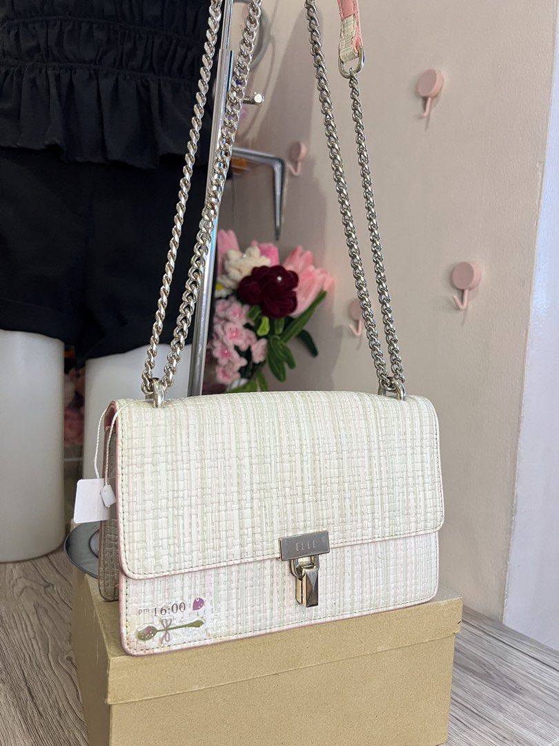 ELLE shoulder / Sling bag (Category: Shoulder Bags) located in Quezon City. Submitted by handpicked_collections_ph (Listing ID 1470662972, Image 3). Description: off-white textured/tweed crossbody bag from the brand ELLE..