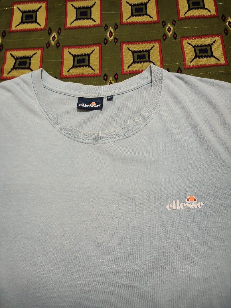 Ellesse Blue Tee (Category: Tshirts & Polo Shirts ) located in Lapu Lapu. Submitted by rebuild.arkives (Listing ID 1470615344, Image 2). Description: Ellesse Blue Tee ‎ ‎📏 Size Guide (Inches): ‎Length: 29 ‎Width: 20 ‎ ‎Color: 9/10 ‎Condition: 9/10 ‎Issue: None ‎ ‎📝 Heads up: ‎• This is a thrift item so please manage your expectations. ‎• Color may slightly differ due to lighting. ‎• Washed and ready to wear. ‎• Shipping Fee is not yet included.
