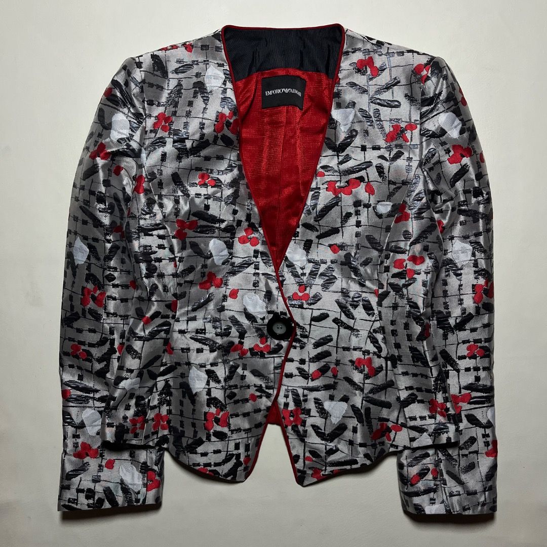 Emporio Armani Silver Red Patterned Blazer Jacket (Category: Coats, Jackets and Outerwear) located in Caloocan City. Submitted by achilles_grails (Listing ID 1470728063, Image 1). Description: - Brand: Emporio Armani designer blazer - Color/Pattern: Silver grey base with black abstract strokes and bright red floral accents - Design: Collarless neckline, single-button front closure, and curved hem - Lining: Striking red textured interior lining - 