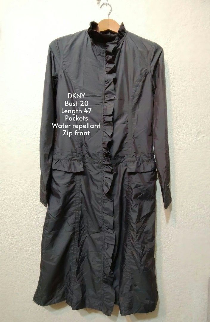 EUC rain proof DKNY trench (Category: Coats, Jackets and Outerwear) located in Bacolod City. Submitted by jljljljljljl (Listing ID 1470678362, Image 2). Description: EUC. A DKNY trench coat made of polyester. rain proof. pocketa and ruffle details. size is small but fits up to medium..