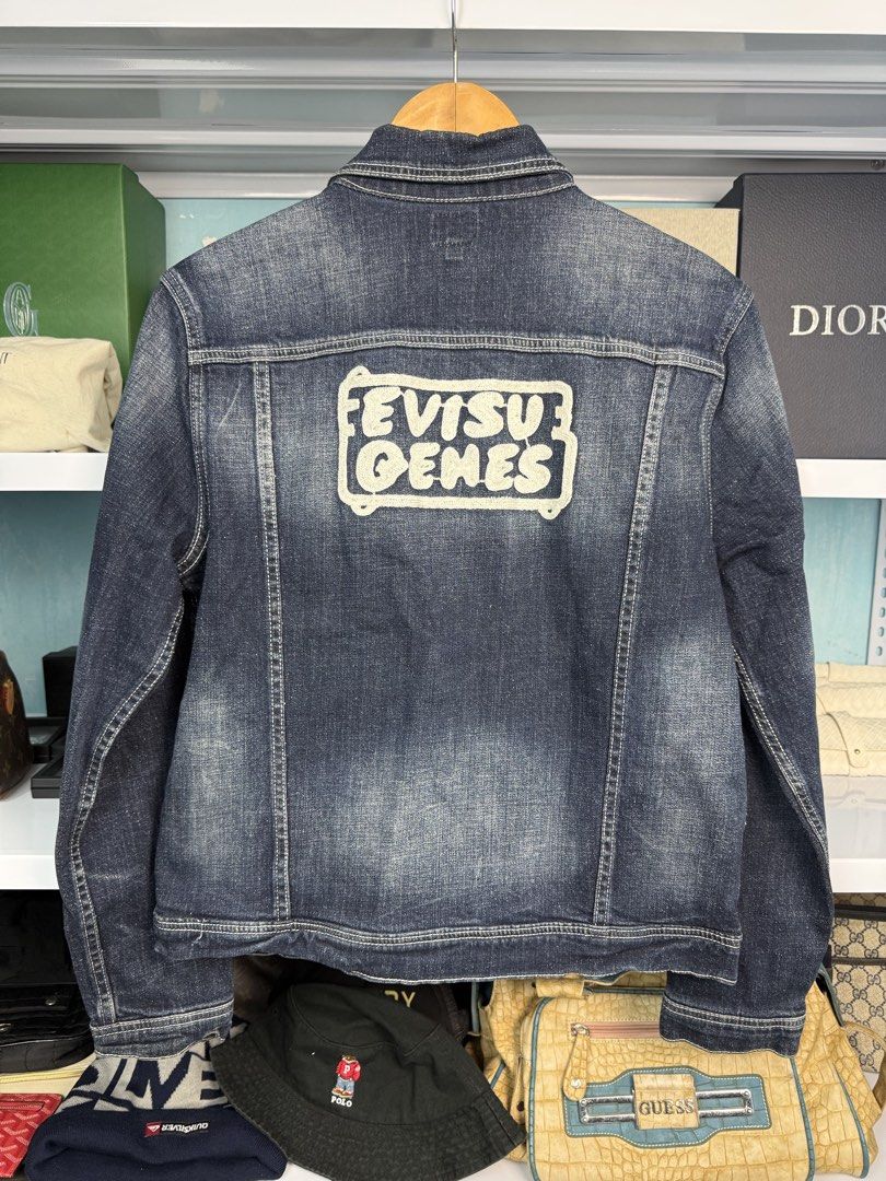 EVISU (Category: Coats, Jackets and Outerwear) located in Quezon City. Submitted by generalmerchandiseph (Listing ID 1470734363, Image 3). Description: - EVISU MULTI POCKET DENIM TRUCKER JACKET WITH EVISU SEAGULL LOGO - DARK WASHED COLORWAY - UTILITARIAN FRONT POCKETS - HEAVY DENIM MATERIAL - EXCELLENT USED CONDITION - 20W X 23.5L DIMENSIONS BOXY - SMALL-MEDIUM UNISEX - HONGKONG / JAPAN SOURCES ✈️ - WASHED AND READY TO WEAR 🫧.