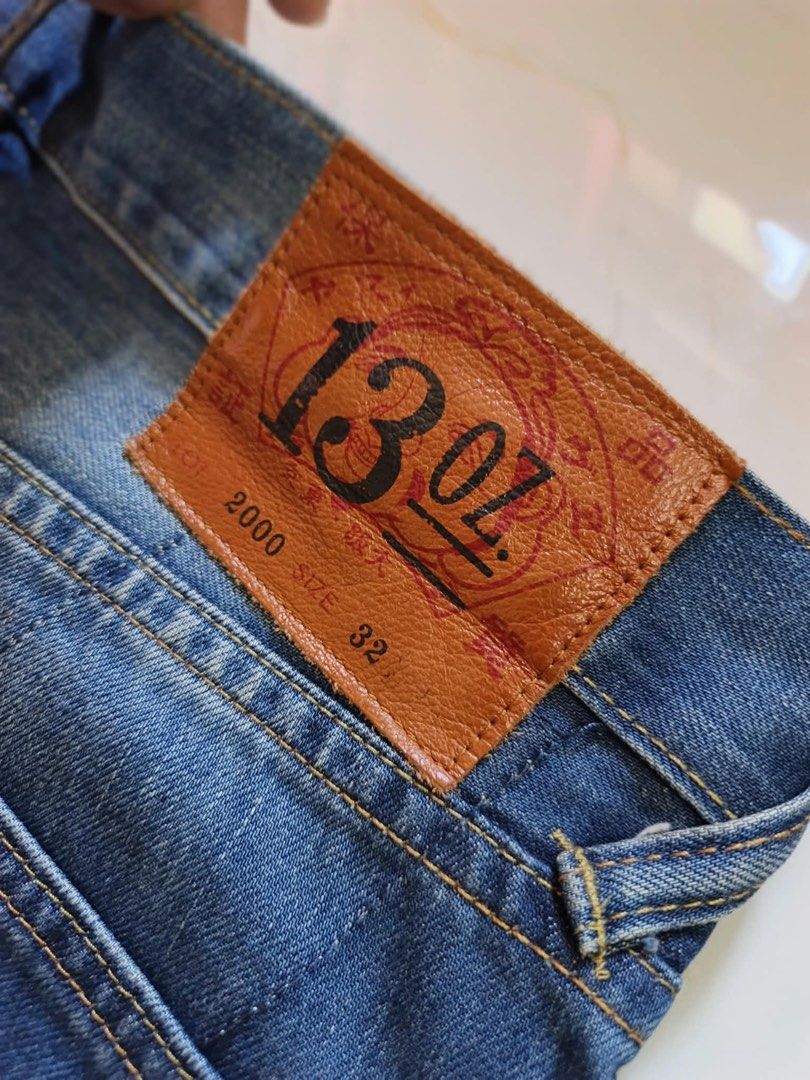 Evisu 2000 Yellow Seagull Denim Jeans Size 32 (Category: Jeans) located in Bustos. Submitted by thenlnclot60500 (Listing ID 1470650998, Image 2). Description: - Brand: Evisu Model 2000 - Size: 32 - Fit: Classic straight leg - Wash: Medium blue with subtle distressing and whiskering - Details: Iconic yellow seagull print on back pockets, button fly closure - Authenticity: Leather back patch, interior cotton waist label, and care tags included - Co