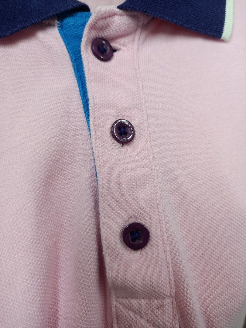 Evisu Pink Polo Shirt Size 95 M (Category: Tshirts & Polo Shirts ) located in Bayombong. Submitted by rheaaa00530 (Listing ID 1470669584, Image 3). Description: - Brand: Evisu - Size: 95 (Medium) - Color: Pink with dark blue collar and bright blue inner placket - Details: Purple branded buttons, white embroidered chest logo, and right sleeve patch - Material: 100% cotton - Condition: Clean, well-maintained pre-loved piece.