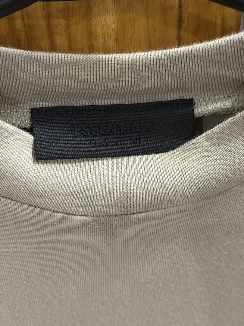 Fear of God Essentials Long Sleeve Tee (Category: Coats, Jackets and Outerwear) located in Naga. Submitted by oldthangs13 (Listing ID 1470682073, Image 2). Description: - Brand: Fear of God Essentials - Color: Light khaki / Taupe - Size: 14/16 (inner tag) - Condition: Like new -Authentic .