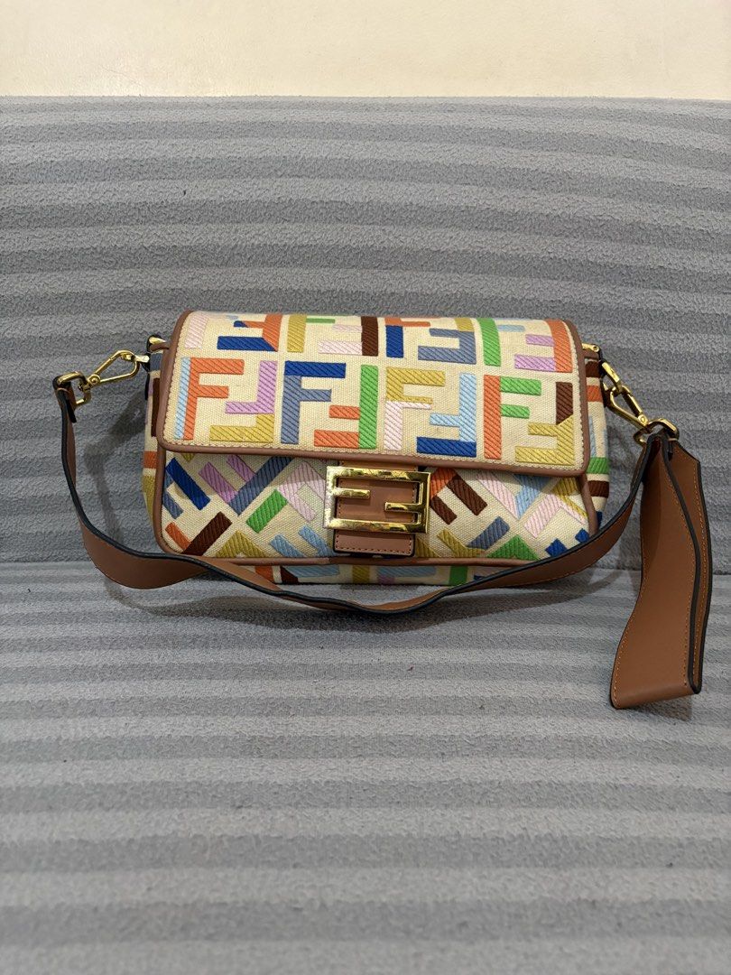 Fendi Colorful Monogram Canvas Shoulder Bag (Category: Luxury Bags & Wallets) located in Pasig City. Submitted by mau_llamas (Listing ID 1470743170, Image 1). Description: - Brand: Fendi - Pattern: Classic Zucca monogram on multicolor canvas - Details: Brown leather trim, gold-tone hardware, and signature FF clasp lock - Interior: Zippered pocket with "Made in Italy" metal plaque and canvas lining - Condition: Good vintage condition with some dis