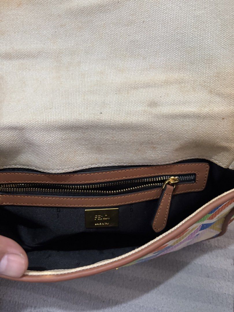 Fendi Colorful Monogram Canvas Shoulder Bag (Category: Luxury Bags & Wallets) located in Pasig City. Submitted by mau_llamas (Listing ID 1470743170, Image 2). Description: - Brand: Fendi - Pattern: Classic Zucca monogram on multicolor canvas - Details: Brown leather trim, gold-tone hardware, and signature FF clasp lock - Interior: Zippered pocket with "Made in Italy" metal plaque and canvas lining - Condition: Good vintage condition with some dis