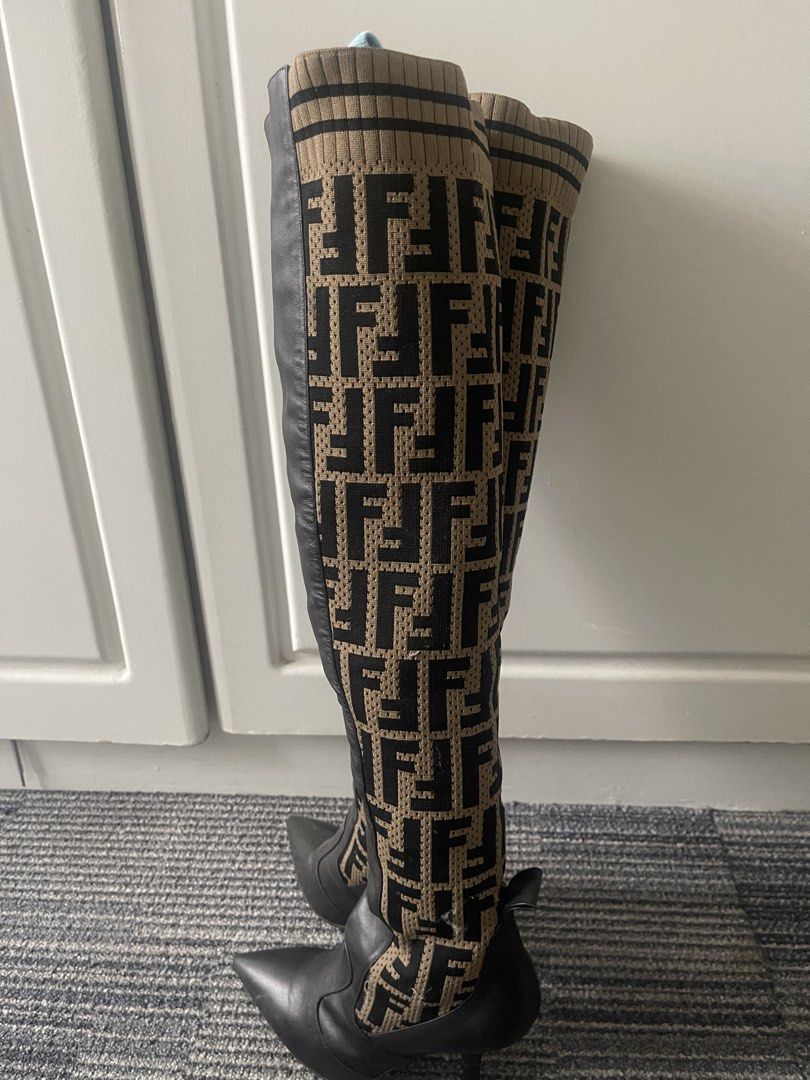 Fendi FF Logo Sock Boots Over-The-Knee Heels (Category: Boots) located in Rizal. Submitted by annelimited_stuffs (Listing ID 1470670930, Image 2). Description: - Authentic Fendi over-the-knee boots, Made in Italy - Size: 38 (printed on sole) - Material: Brown/black FF monogram knit fabric and black leather lower - Design: Pointed toe, stiletto heel, and stylish ribbed top cuff - Condition: Moderate wear on the soles and slight scuffs on the leath