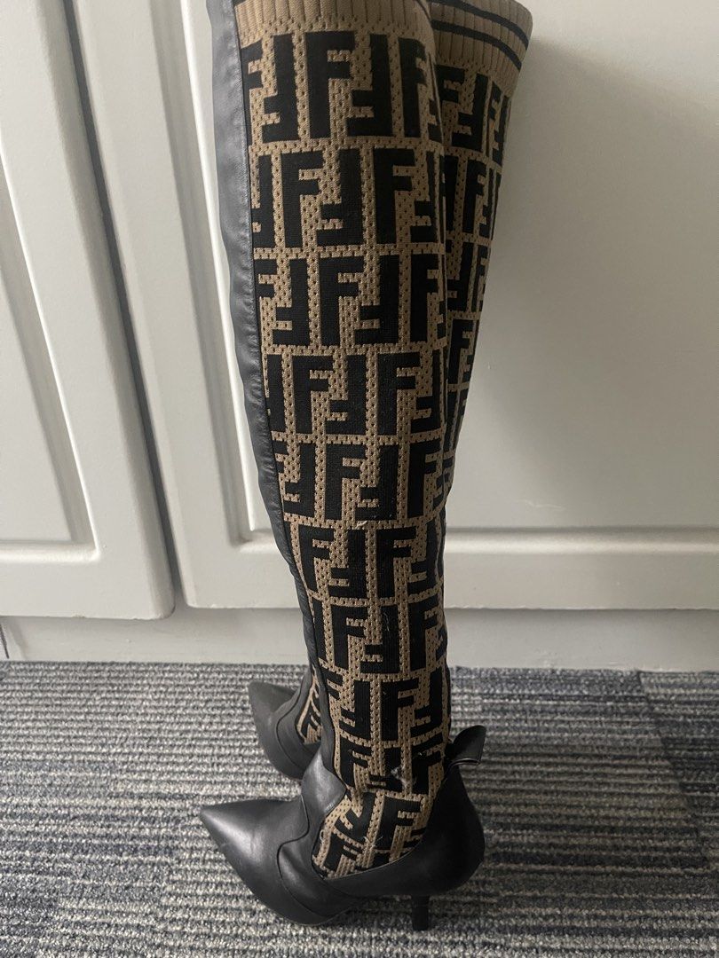 Fendi FF Logo Sock Boots Over-The-Knee Heels (Category: Boots) located in Rizal. Submitted by annelimited_stuffs (Listing ID 1470670930, Image 3). Description: - Authentic Fendi over-the-knee boots, Made in Italy - Size: 38 (printed on sole) - Material: Brown/black FF monogram knit fabric and black leather lower - Design: Pointed toe, stiletto heel, and stylish ribbed top cuff - Condition: Moderate wear on the soles and slight scuffs on the leath