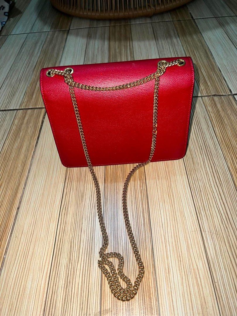 Fendi Kan I Red Leather Shoulder Bag (Category: Luxury Bags & Wallets) located in Dagupan City. Submitted by makilux.ph (Listing ID 1470635084, Image 3). Description: - Authentic Fendi shoulder bag in bold red textured leather - Elegant gold-tone chain strap and matching hardware - Flap closure with iconic signature twist lock and edgy conical stud accents - Luxurious grey suede interior lining featuring the classic FF logo fabric pattern - Conve