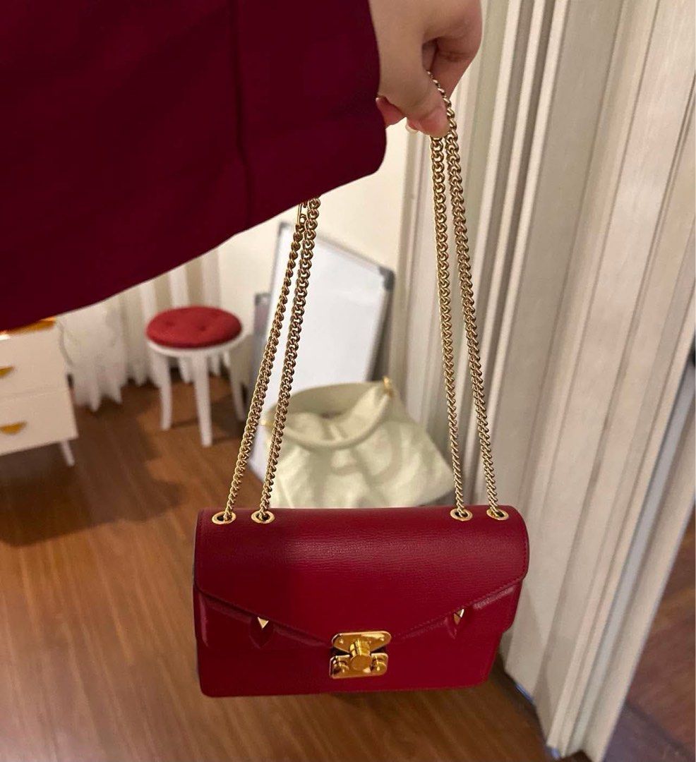 Fendi Kan I Red Leather Shoulder Bag (Category: Luxury Bags & Wallets) located in Dagupan City. Submitted by makilux.ph (Listing ID 1470635084, Image 1). Description: - Authentic Fendi shoulder bag in bold red textured leather - Elegant gold-tone chain strap and matching hardware - Flap closure with iconic signature twist lock and edgy conical stud accents - Luxurious grey suede interior lining featuring the classic FF logo fabric pattern - Conve