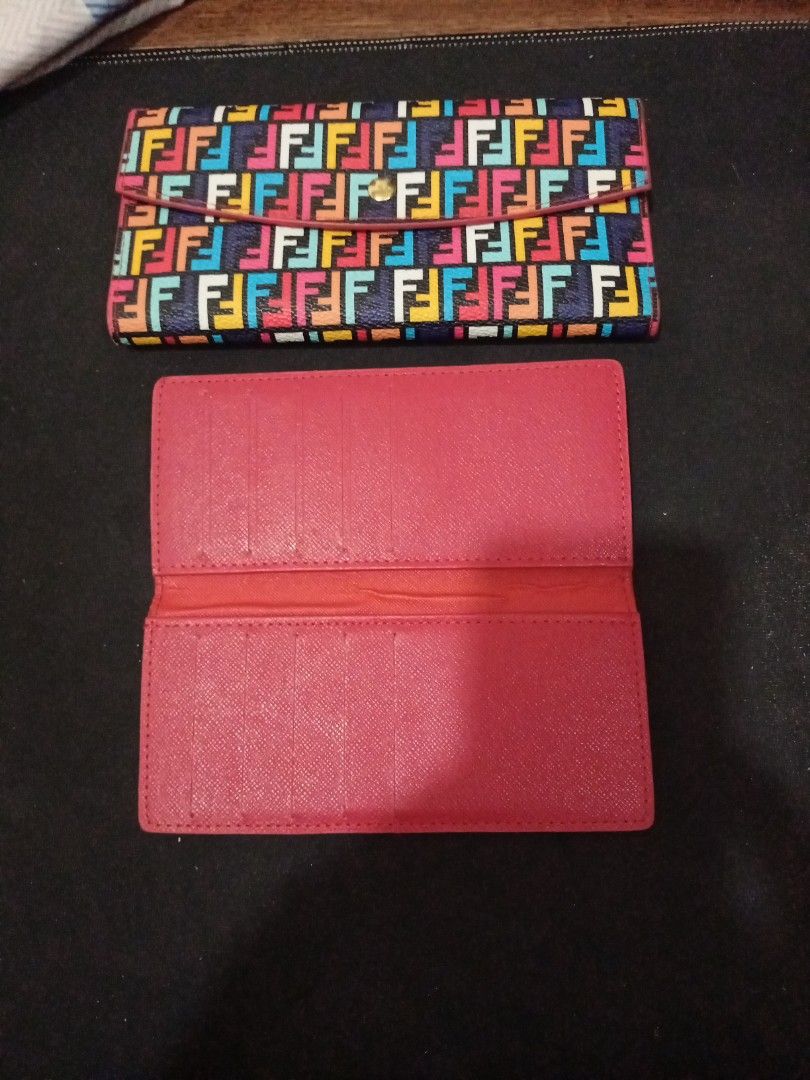 Fendi Roma Multi-color Monogram Long Wallet (Category: Luxury Bags & Wallets) located in Manila. Submitted by luckyeagle-7ff8 (Listing ID 1470588676, Image 3). Description: - Authentic Fendi Roma long wallet with colorful multi F monogram print - Eye-catching bright pink interior lining - Features multiple card slots, slip pockets, and a secure zippered coin compartment - Elegant gold-tone hardware with Fendi logo pull and snap button closure - I