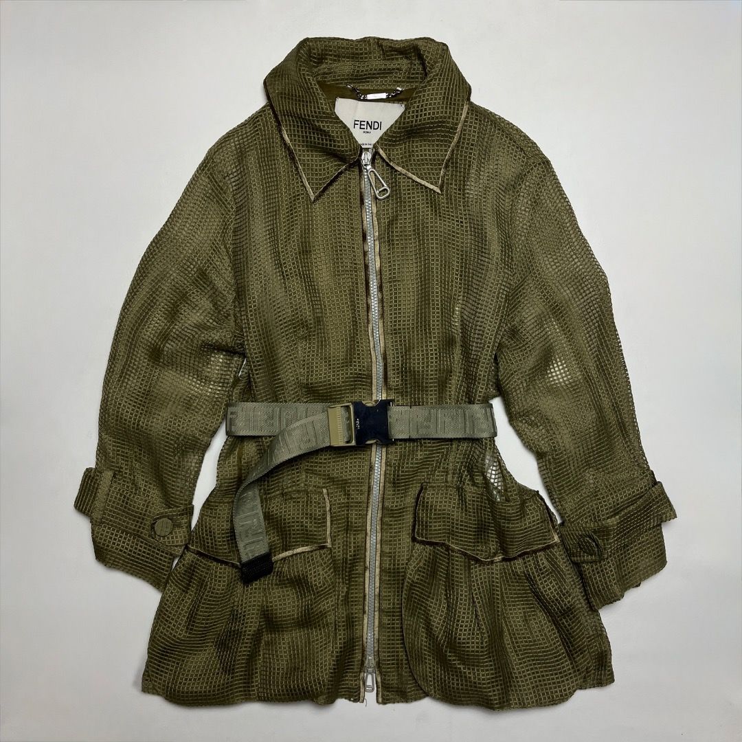 Fendi Roma Olive Green Grid Mesh Trench Coat (Category: Luxury Apparel) located in Caloocan City. Submitted by achilles_grails (Listing ID 1470566705, Image 1). Description: - Authentic Fendi Roma olive green casual jacket, made in Italy - Textured grid mesh fabric with full front zip and branded dual pullers - Includes a matching adjustable webbed belt with metallic Fendi-engraved buckle - Size: IT 38 / UK 6 / US 2 / Small - Clean interior tags 