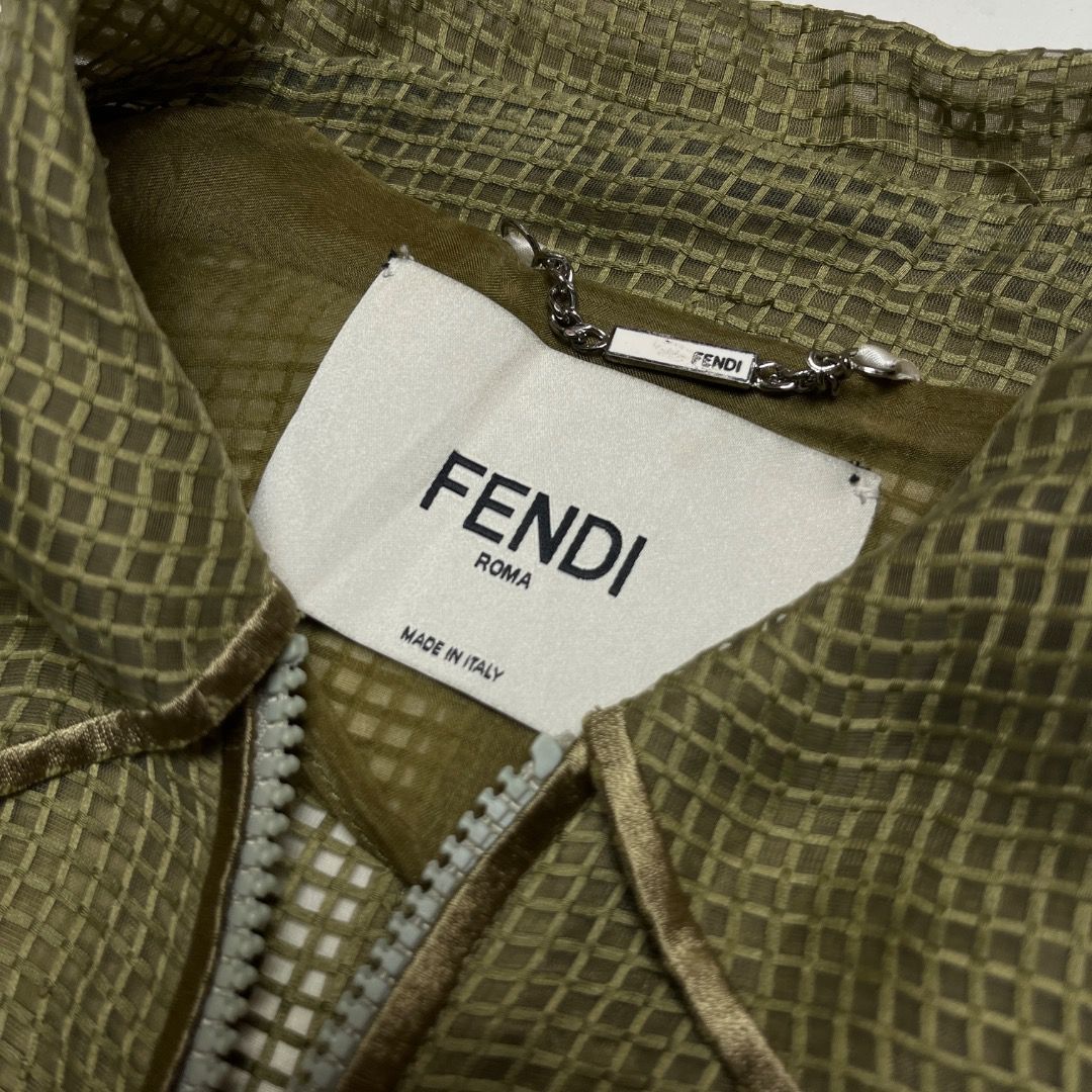 Fendi Roma Olive Green Grid Mesh Trench Coat (Category: Luxury Apparel) located in Caloocan City. Submitted by achilles_grails (Listing ID 1470566705, Image 3). Description: - Authentic Fendi Roma olive green casual jacket, made in Italy - Textured grid mesh fabric with full front zip and branded dual pullers - Includes a matching adjustable webbed belt with metallic Fendi-engraved buckle - Size: IT 38 / UK 6 / US 2 / Small - Clean interior tags 