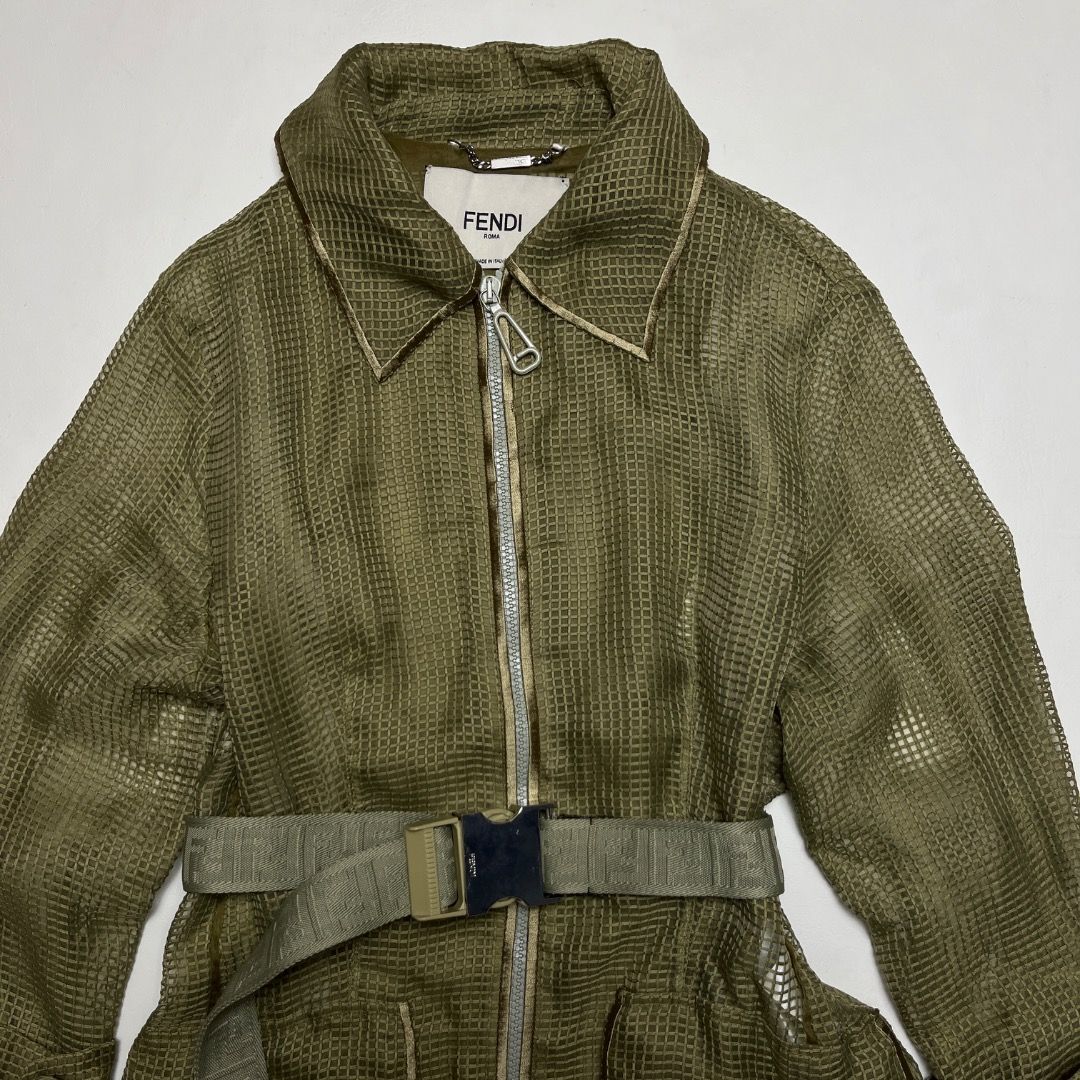 Fendi Roma Olive Green Grid Mesh Trench Coat (Category: Luxury Apparel) located in Caloocan City. Submitted by achilles_grails (Listing ID 1470566705, Image 2). Description: - Authentic Fendi Roma olive green casual jacket, made in Italy - Textured grid mesh fabric with full front zip and branded dual pullers - Includes a matching adjustable webbed belt with metallic Fendi-engraved buckle - Size: IT 38 / UK 6 / US 2 / Small - Clean interior tags 