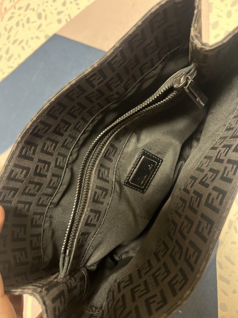 Fendi Zucca Monogram Canvas Tote Bag (Category: Luxury Bags & Wallets) located in Manila. Submitted by aliyahkennedy (Listing ID 1470701499, Image 2). Description: - Authentic vintage black Fendi tote with iconic Zucca monogram pattern - Slim leather shoulder straps with polished silver-tone hardware - Signature interlocking FF logo plaque on the front - Secure top zip closure with a lined, spacious interior - Includes an inner zippered pocket an