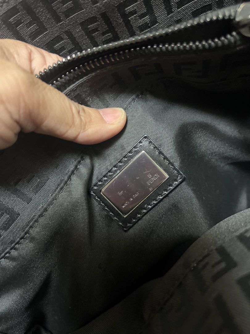 Fendi Zucca Monogram Canvas Tote Bag (Category: Luxury Bags & Wallets) located in Manila. Submitted by aliyahkennedy (Listing ID 1470701499, Image 3). Description: - Authentic vintage black Fendi tote with iconic Zucca monogram pattern - Slim leather shoulder straps with polished silver-tone hardware - Signature interlocking FF logo plaque on the front - Secure top zip closure with a lined, spacious interior - Includes an inner zippered pocket an