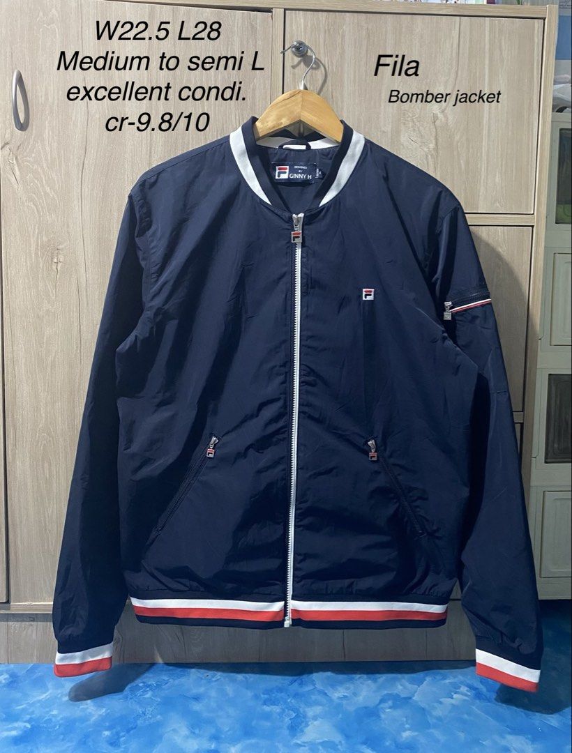 Fila bomber jacket (Category: Coats, Jackets and Outerwear) located in Binan City. Submitted by rnj_affordable (Listing ID 1470728883, Image 1). Description: no issue color navy blue.