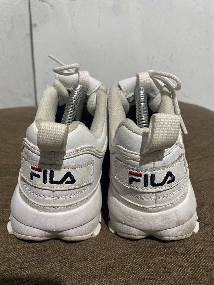 Fila Disruptor II White Chunky Sneakers (Category: Sneakers) located in Calabanga. Submitted by balobalocr30793 (Listing ID 1470682334, Image 2). Description: White Fila Disruptor II chunky sneakers with classic embroidered branding on the side, heel, and tongue. Chunky serrated rubber soles with good grip. Padding around the ankle collar for support. Normal signs of wear on the uppers and bottom soles from previous use. US 6.5 EU 37.5 UK 4 .
