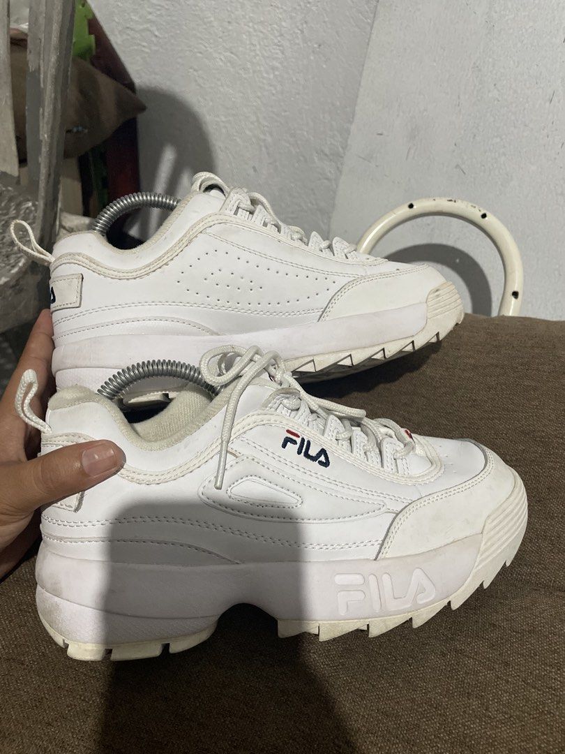 Fila Disruptor II White Chunky Sneakers (Category: Sneakers) located in Calabanga. Submitted by balobalocr30793 (Listing ID 1470682334, Image 3). Description: White Fila Disruptor II chunky sneakers with classic embroidered branding on the side, heel, and tongue. Chunky serrated rubber soles with good grip. Padding around the ankle collar for support. Normal signs of wear on the uppers and bottom soles from previous use. US 6.5 EU 37.5 UK 4 .
