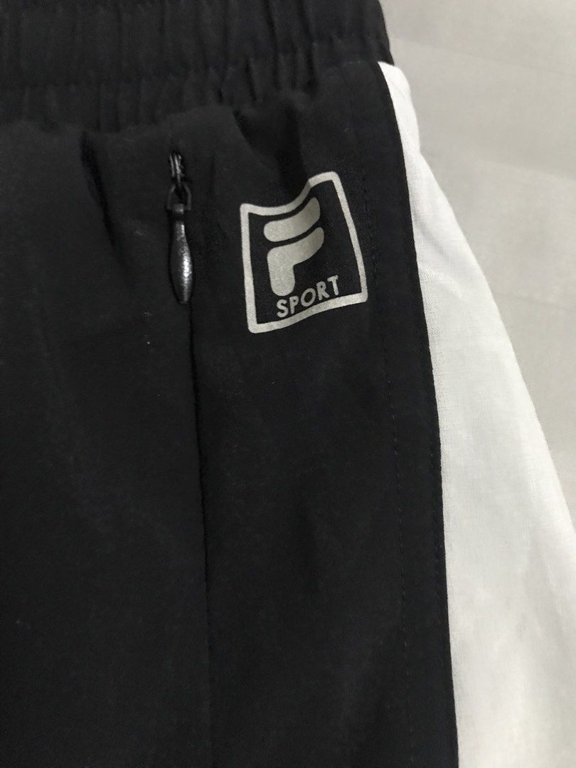 Fila Running Short (Category: Activewear) located in Manila. Submitted by freshlemon58885 (Listing ID 1470566842, Image 2). Description: With 1 sides zipper pocket With inner underwear Adjustable string Band Medium on tag Made in Vietnam .