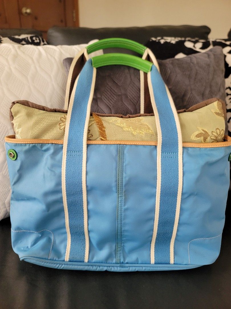 FIXED PRICE! Preloved Coach Hampton Reversible Bag (see description) (Category: Luxury Bags & Wallets) located in Quezon City. Submitted by justdeclutter_ (Listing ID 1470587099, Image 3). Description: Preloved, personally owned, store bought from US Reversible bag With care card No major flaws, minimal bubbles, needs deep cleaning, nastuck sa closet Bawal sa maarte This Coach #6268 Mini Hampton Sky Blue Tote Bag is perfect for a casual occasion.