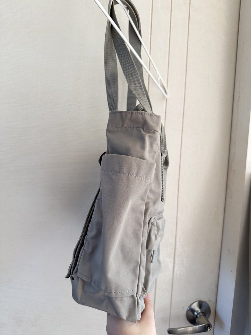 Fjallraven Kanken Convertible Bag (Category: Backpacks) located in Manila. Submitted by cinnmoroll (Listing ID 1470596972, Image 3). Description: - Brand/Model: Fjällräven Kånken Totepack - Color: Grey - Versatile design: Easily converts from a tote to a backpack - Condition: Barely used (with a small stain on the side panel, check the last photo) - Features: Plenty of pockets for easy organization, perfect for daily use - Original Retail Price: 