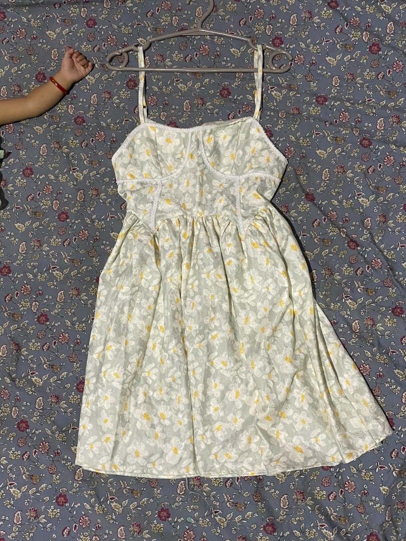 Floral spaghetti strap mini dress (Category: Dresses) located in Tarlac. Submitted by fastdragon_d1826f (Listing ID 1470669665, Image 1). Description: - Green and yellow floral print - Spaghetti straps with lace-trimmed sweetheart neckline - Fitted bodice and flared skater skirt - Lightweight fabric, ideal for warm weather.