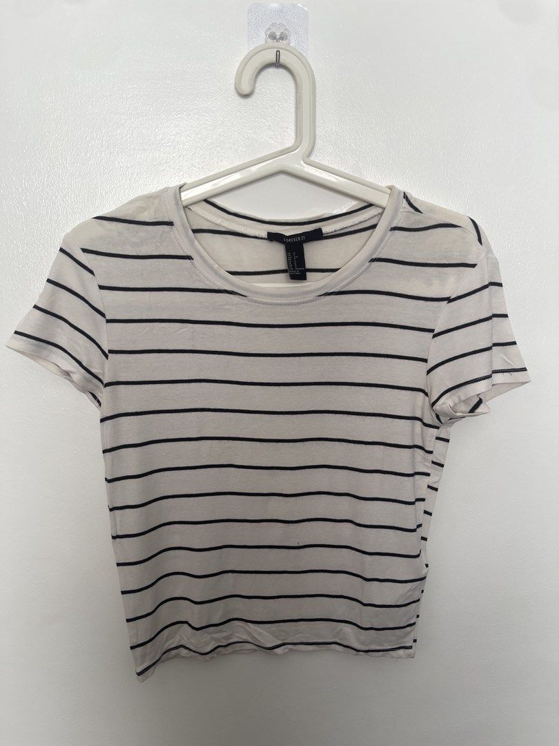 Forever 21 Black and White Striped Crop Top (Category: Shirts) located in Manila. Submitted by lovedbymidge (Listing ID 1470645136, Image 1). Description: 🩷 for xs-s girlies 🚚 lalamove or grab express (sf shouldered by the buyer!) - Brand: Forever 21 - Size: S (US sizing) - Color: White with horizontal black stripes - Material: Soft stretch cotton - Neckline: Scoop neck - Fit: Cropped length, pairs easily with high-waisted jeans or skirts - Con