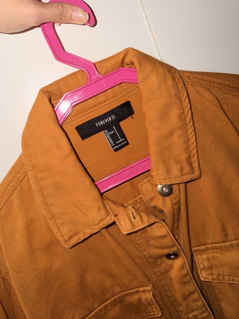 Forever 21 Mustard Brown Crop Denim Jacket Size S (Category: Coats, Jackets and Outerwear) located in Manila. Submitted by kacee18 (Listing ID 1470702207, Image 3). Description: - Brand: Forever 21 - Style: Cropped denim jacket - Color: Mustard brown - Size: Small - Material: Structured cotton - Features: Button-up front, fold-over collar, dual chest pockets with flaps, button cuffs - Condition: Clean, excellent, ready to wear - Perfect for layer