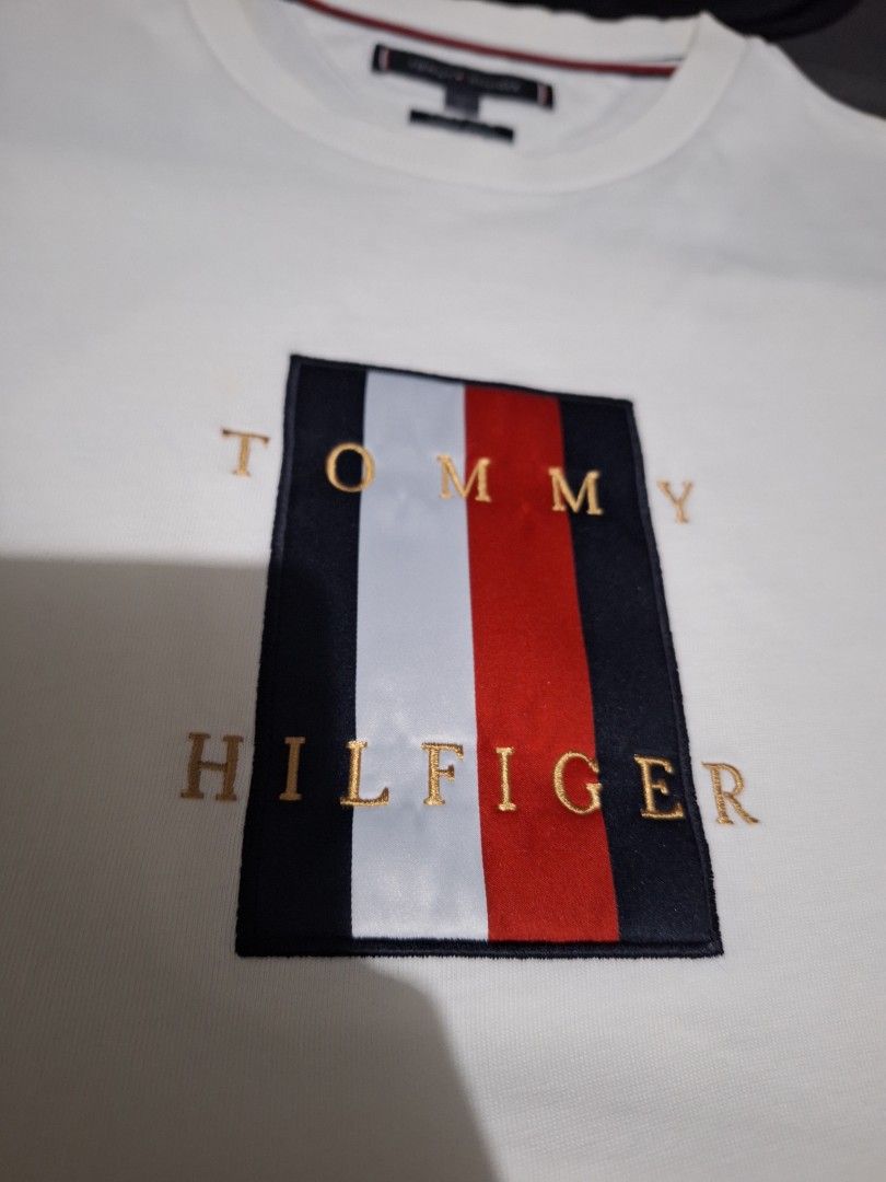 Forsale aspack. Size large (Category: Tshirts & Polo Shirts ) located in Manila. Submitted by adolphreyes645 (Listing ID 1470604362, Image 3). Description: - Brand: Tommy Hilfiger - Size: L - Material: 100% Organic Cotton - Color: Crisp White - Design: Classic embroidered flag logo box with gold lettering on the front - Details: Crew neck with signature interior striped tape - Condition: Excellent/Clean look - Style: Casual everyday staple, great