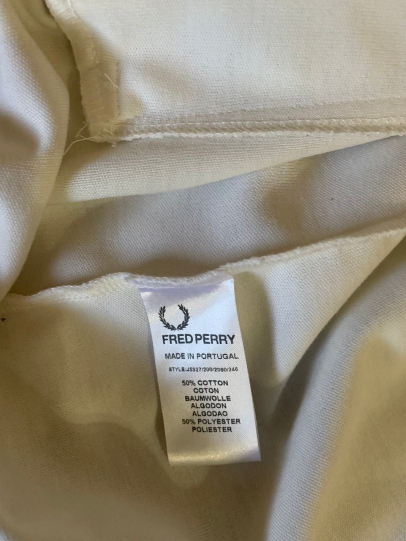 Fred Perry - Track Jacket (Category: Coats, Jackets and Outerwear) located in Paranaque City. Submitted by bulldogdad (Listing ID 1470624603, Image 3). Description: - White with black logo and side stripes - Zip-up front, high-neck collar - Retro Mod design - Used only twice.