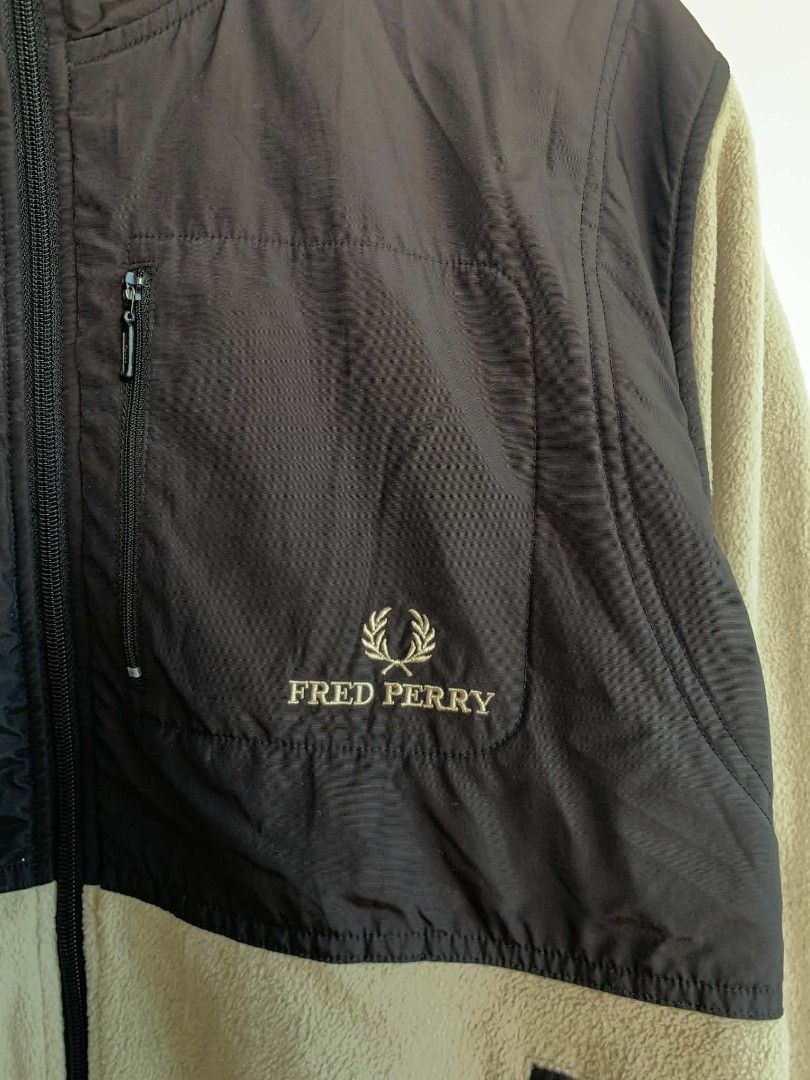 Fred Perry Fleece Zip Jacket Black Beige Size M (Category: Coats, Jackets and Outerwear) located in Manila. Submitted by michaelge38472 (Listing ID 1470705569, Image 2). Description: - Brand: Fred Perry - Item: Fleece zip jacket - Color: Black and beige color block - Size: Medium (tag on collar) - Features: Full zip front, contrast upper chest fabric, zippered pockets, embroidered laurel wreath logo - Condition: Selling as-is, note noticeable bro